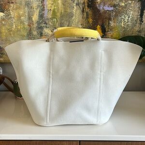 Rothy’s tote bag. Cream colored with yellow handles